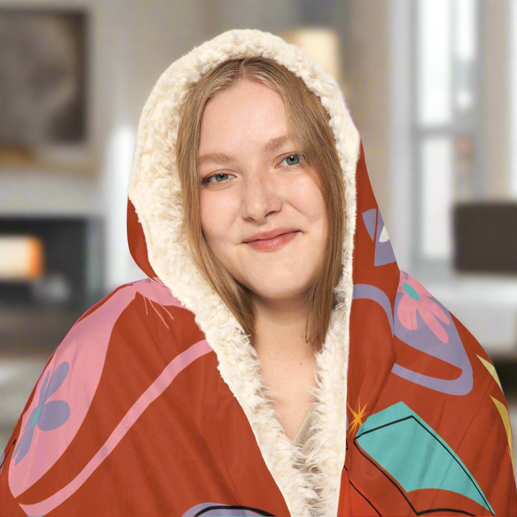 Person wearing a colorful hoodie with a white lining on a white background