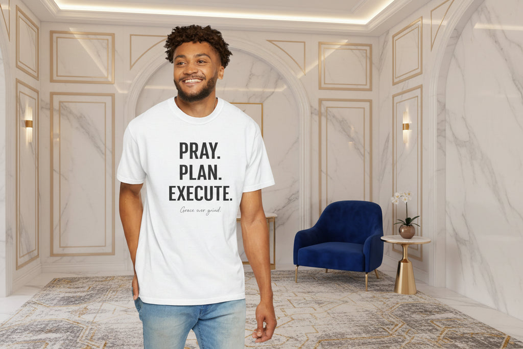 Man wearing a white t-shirt with 'PRAY. PLAN. EXECUTE.' text on a white background