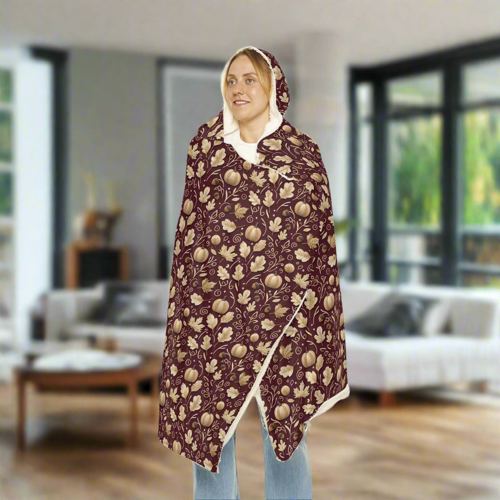 Woman wearing a floral patterned cape on a white background