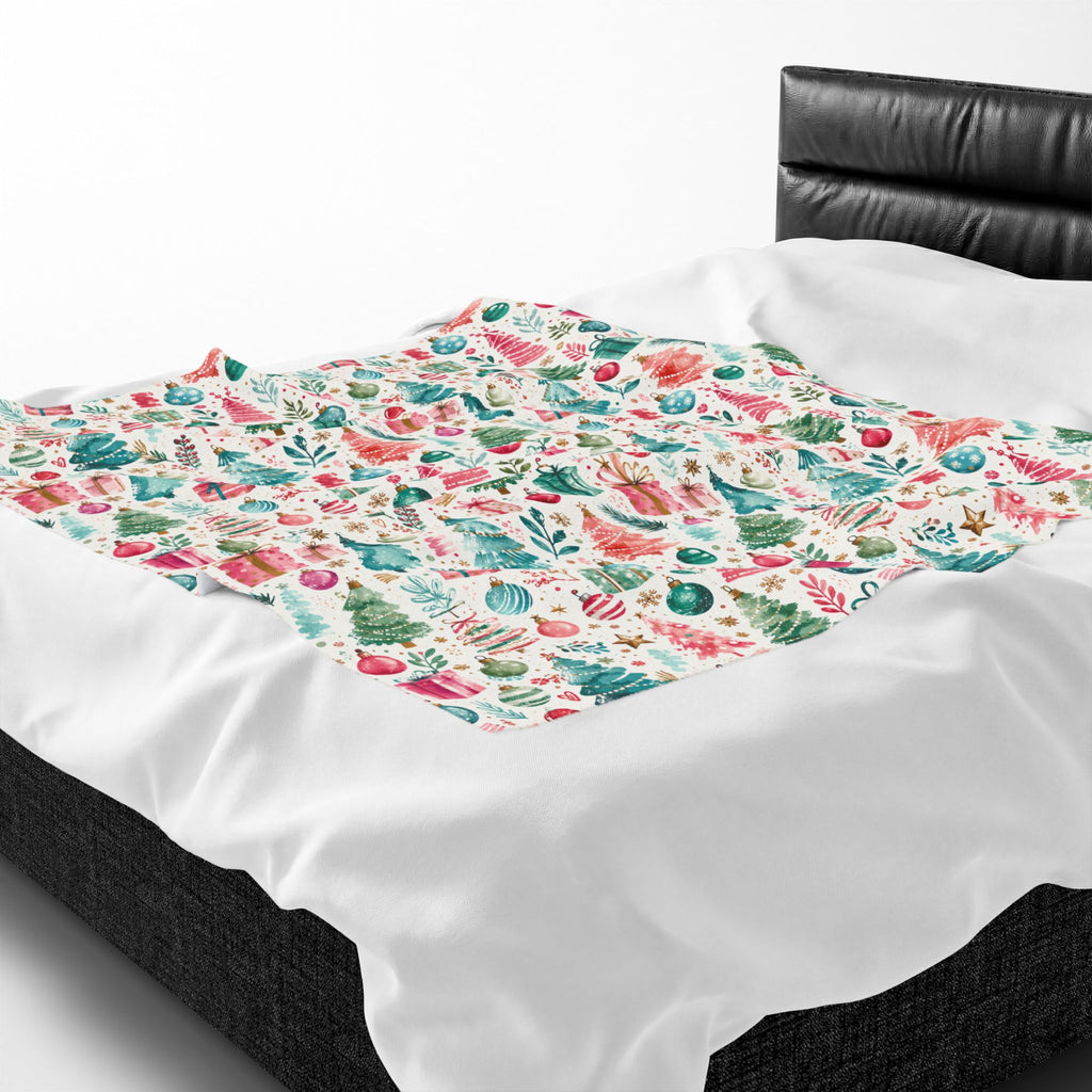 A white throw blanket featuring a colorful underwater seashell and coral print, draped over a bed with a black leather headboard.