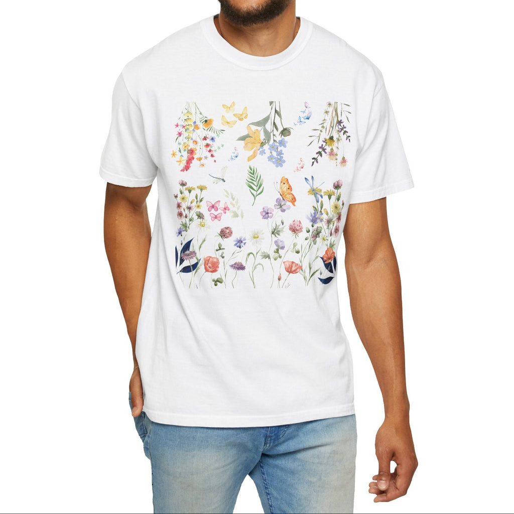 Man wearing a white t-shirt with floral designs on a white background