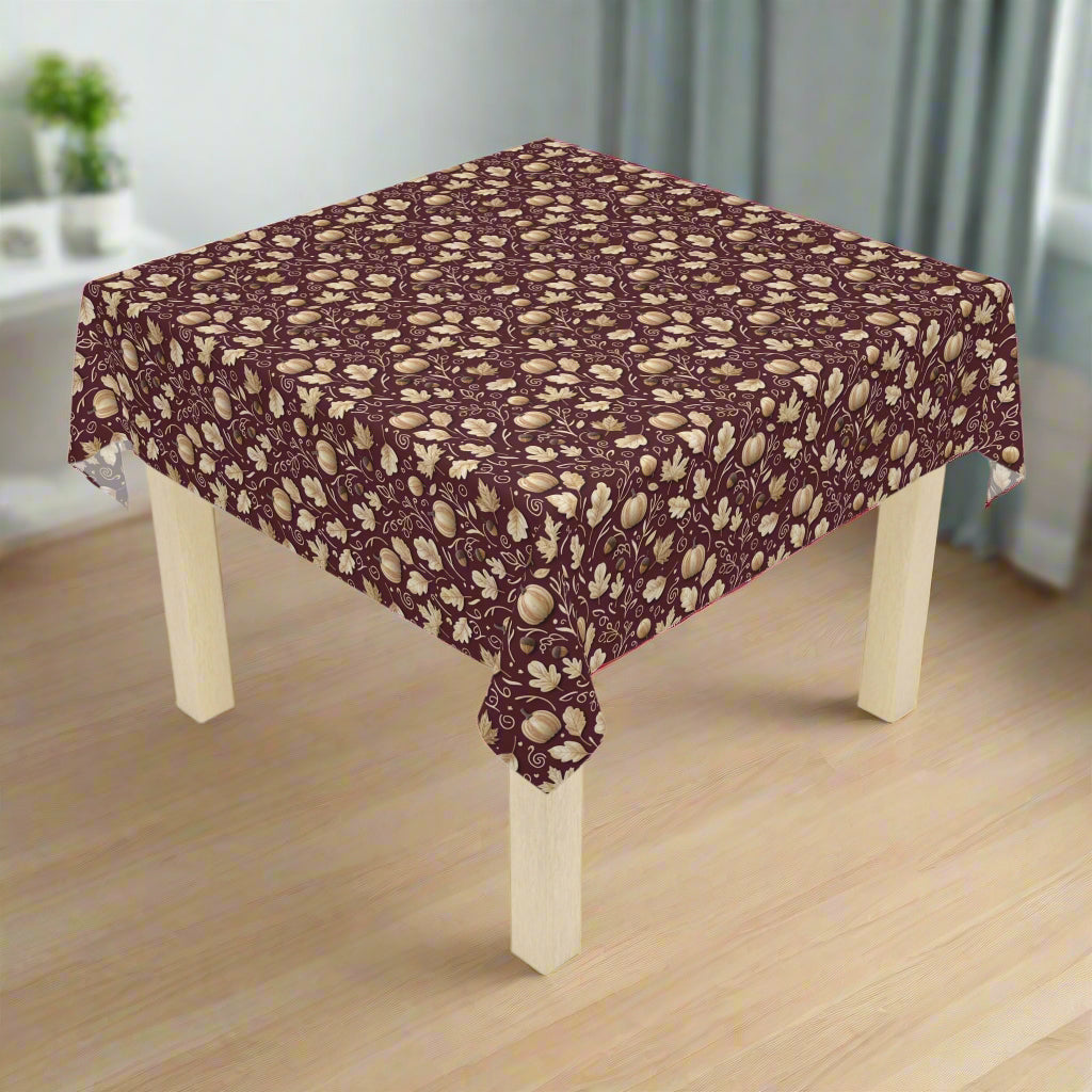Table with a patterned tablecloth on a white background