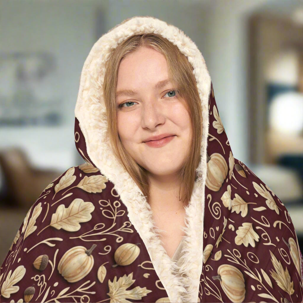Person wearing a floral-patterned hoodie with a white interior lining on a white background