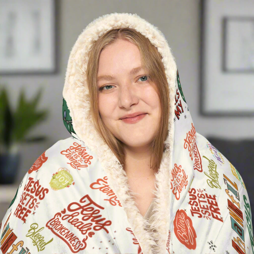 Person wearing a hoodie with text design on a white background