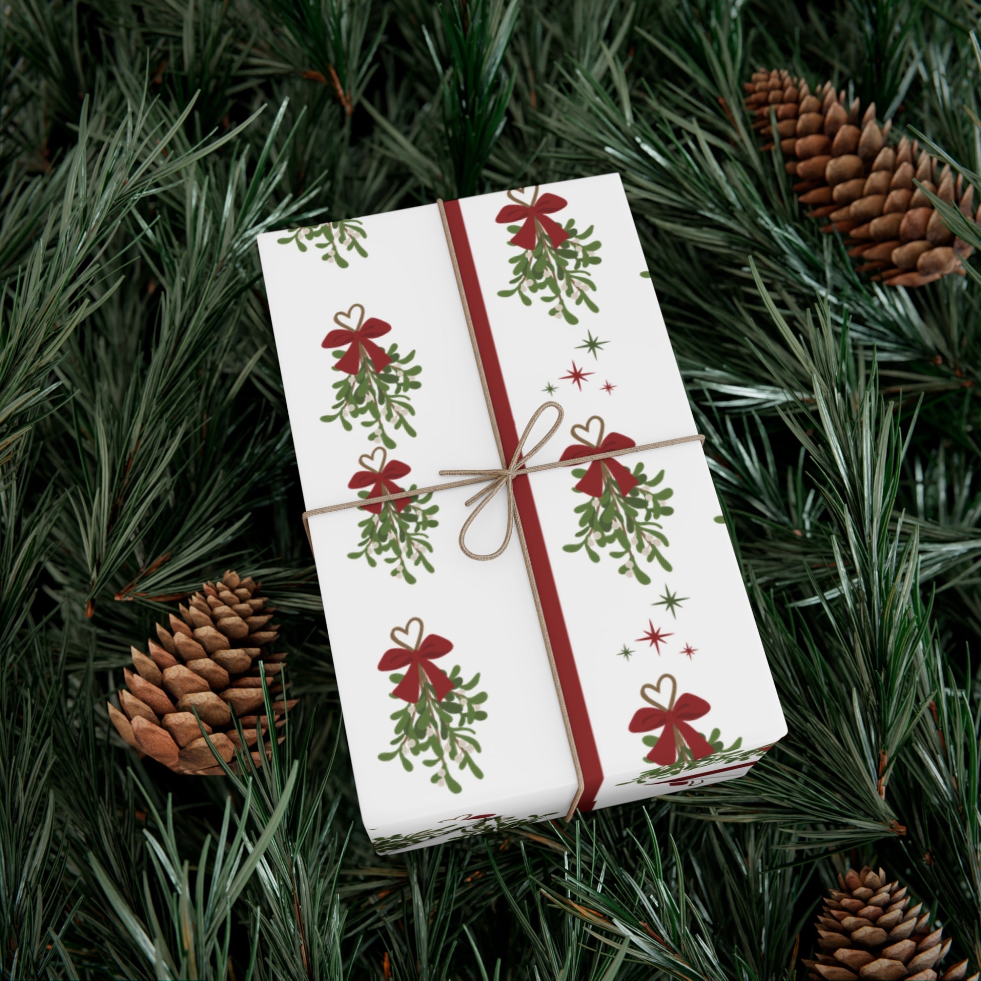 Gift wrapped in festive paper with red ribbons and green trees on a bed of pine needles and pine cones.