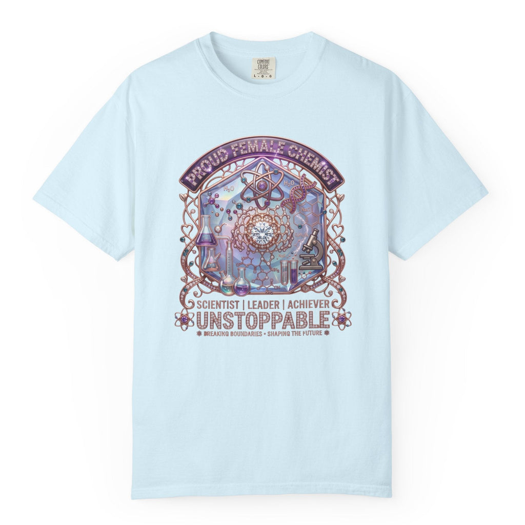 A light blue short-sleeve crewneck t-shirt with a colorful graphic on the front featuring a dreamcatcher and the text 'PROUD FEMINIST CHEMIST', 'SCIENTIST | LEADER | ACHIEVER', and 'UNSTOPPABLE'.