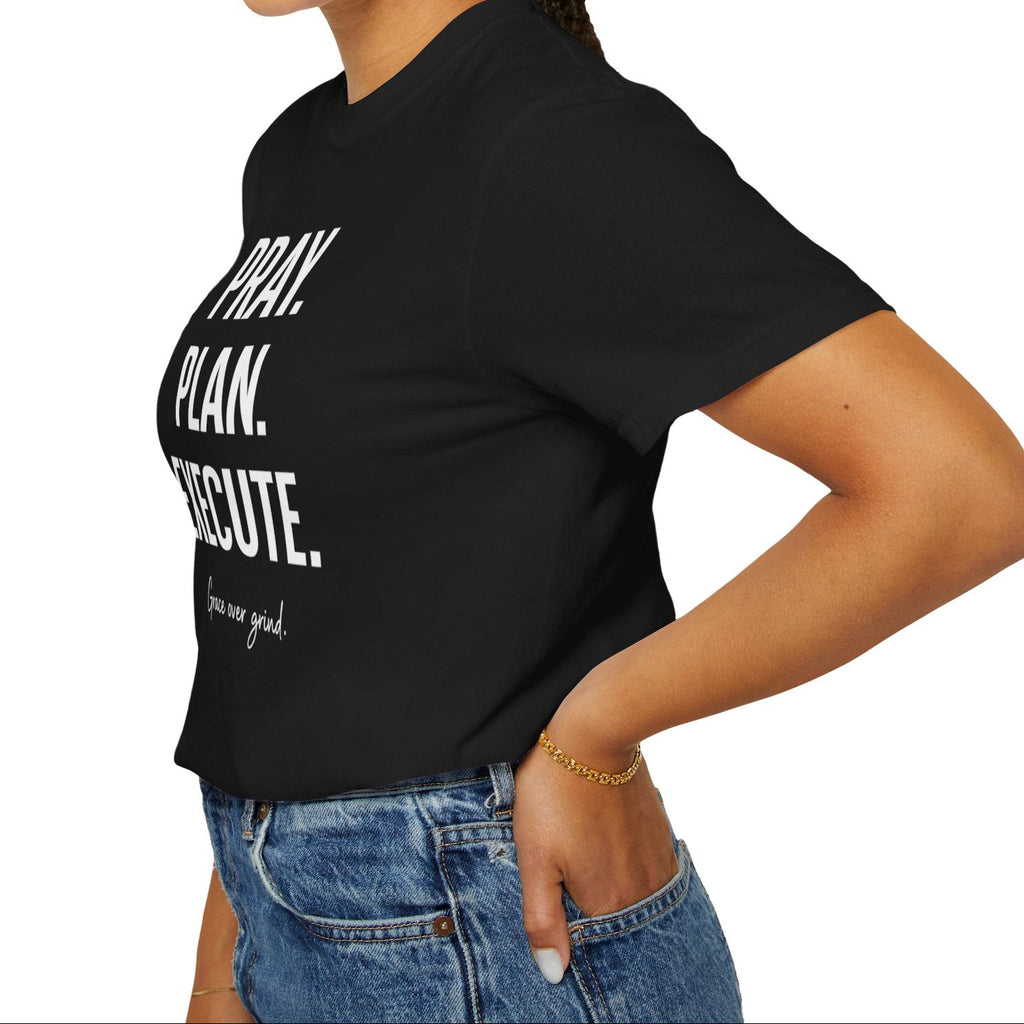 Woman wearing a black t-shirt with text, standing against a white background