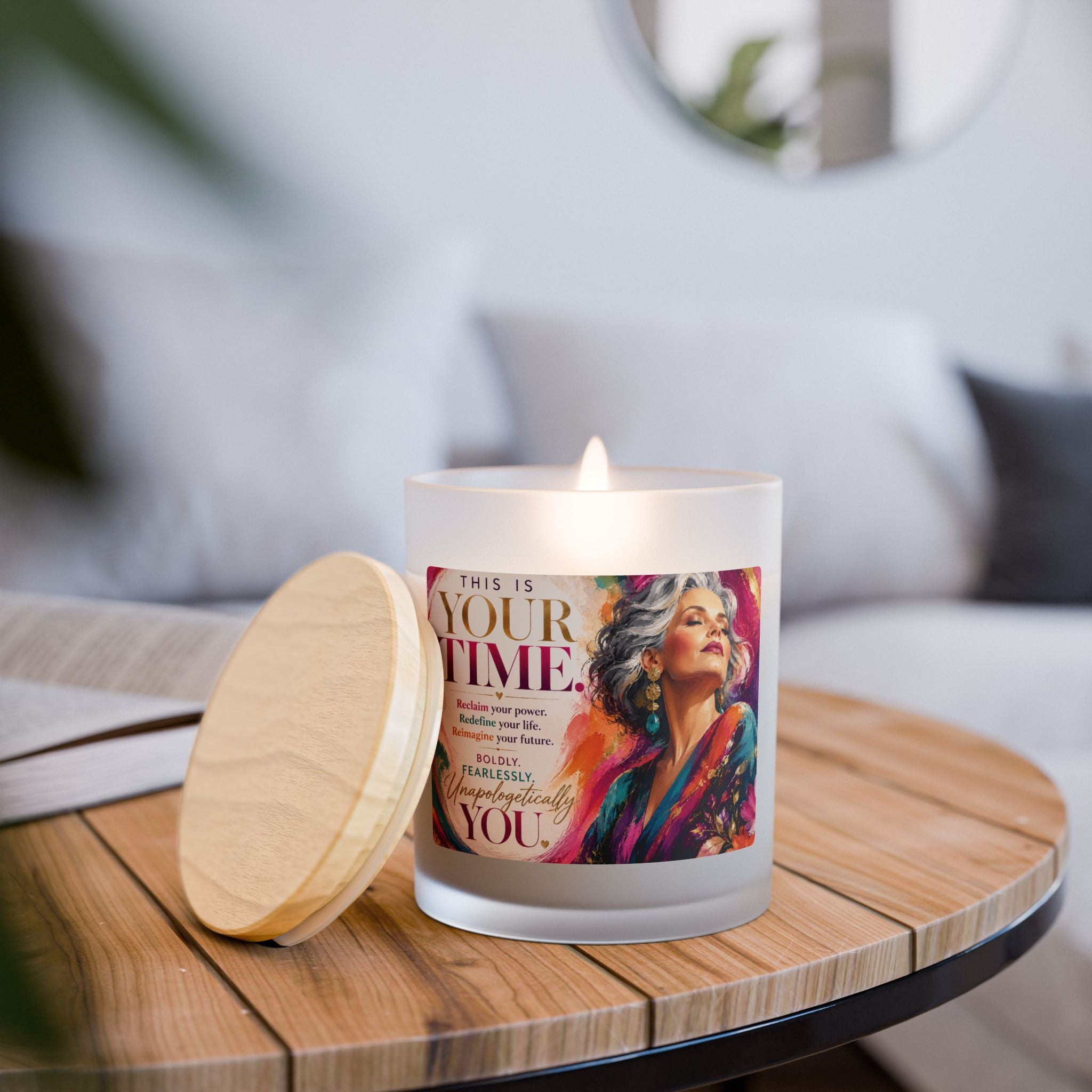 Candle with a motivational label on a wooden table