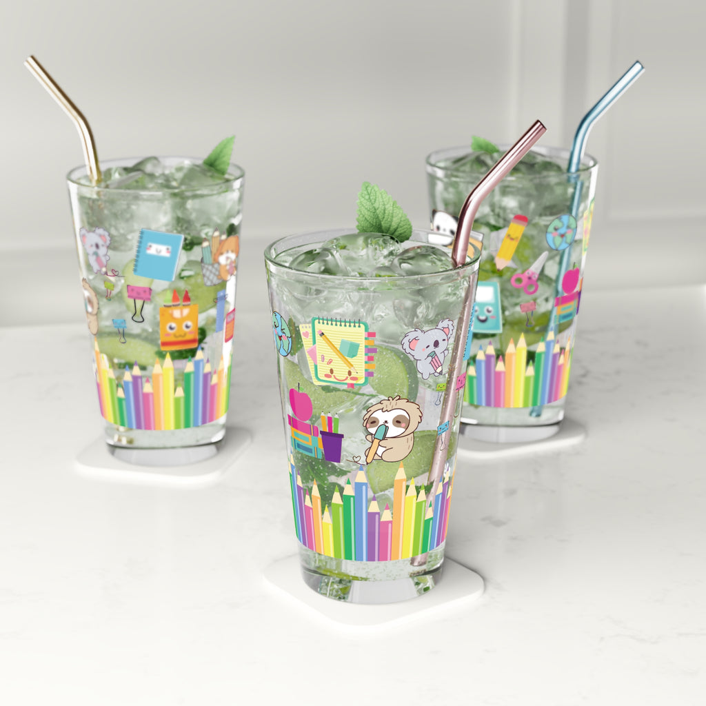 Three glasses with colorful designs and straws on a white background
