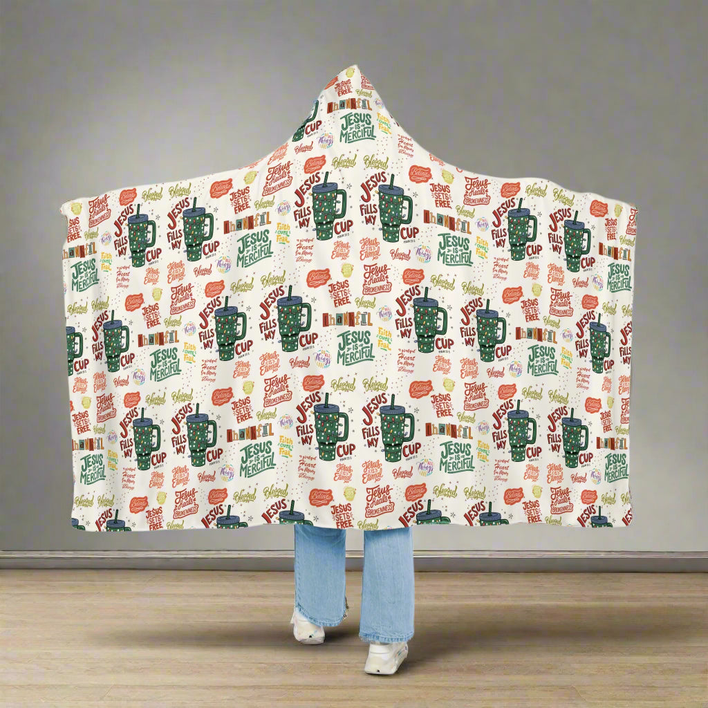 Hooded blanket with colorful design and text on a white background