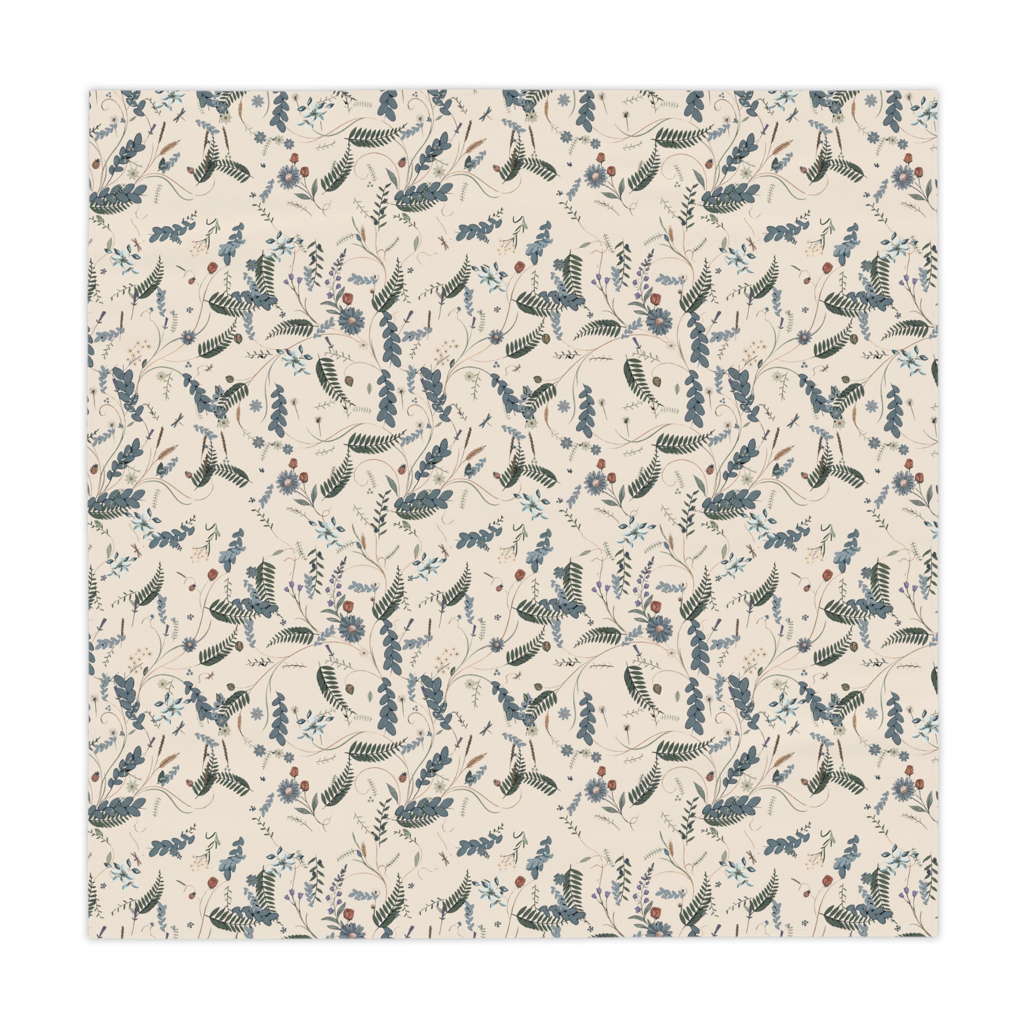 Patterned fabric with blue and black designs on a beige background