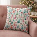 A square throw pillow featuring a festive Christmas watercolor pattern with pine trees, ornaments, gifts, and stars on a cream background, isolated on a white studio background.