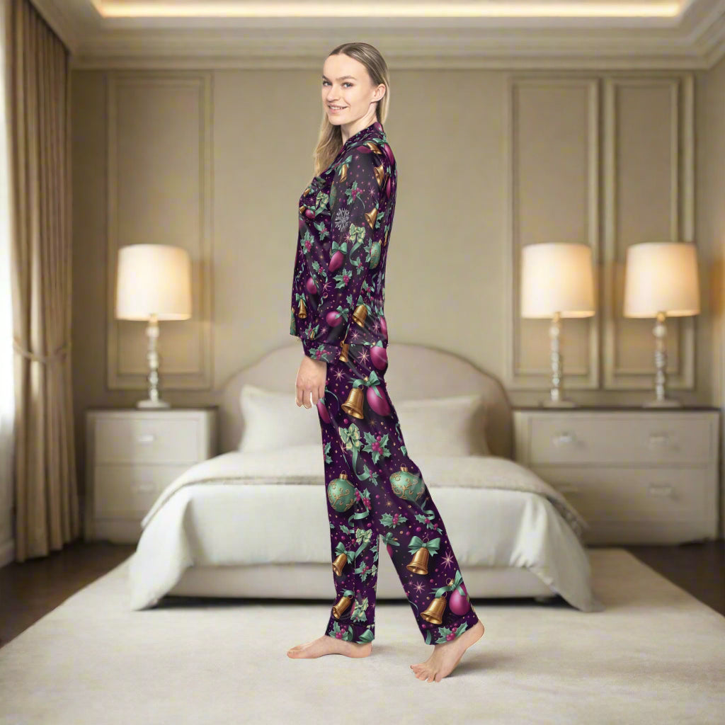 Woman wearing a festive pajama set with a purple pattern on a white background