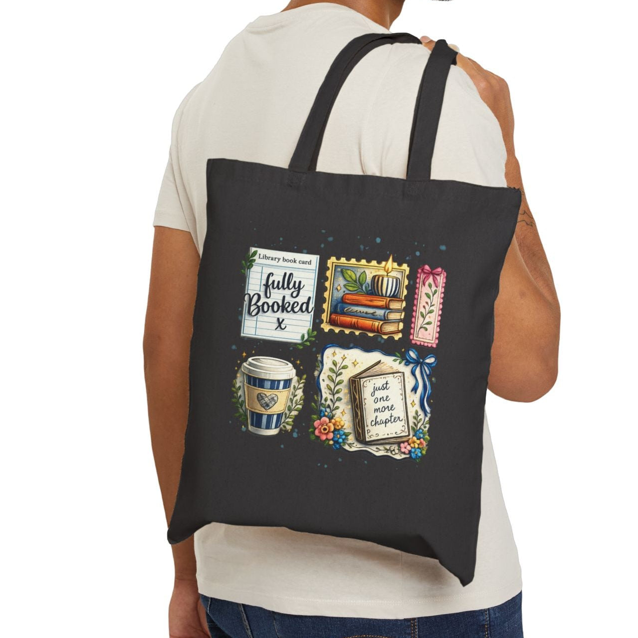 Man carrying a black tote bag with colorful designs on a white background
