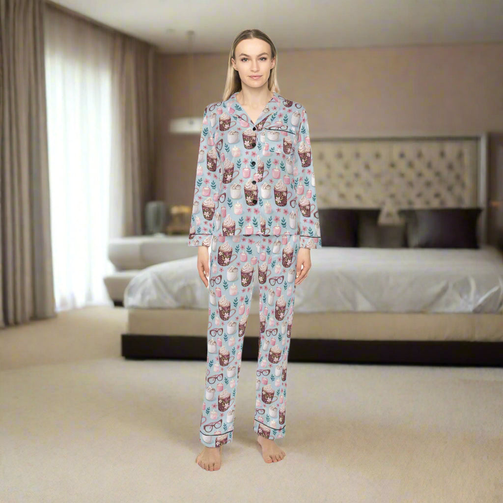 Woman wearing a pajama set with a cat pattern on a white background