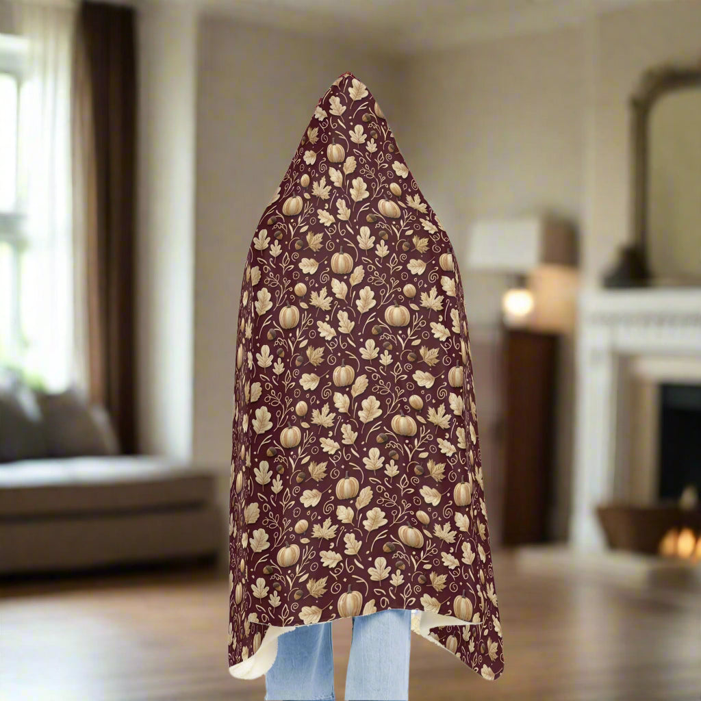 Floral patterned fabric draped over a person on a white background