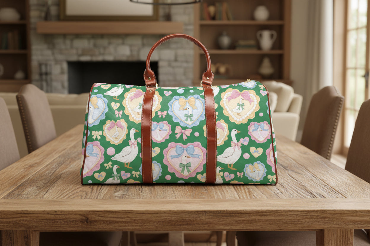 Duffle bag with a colorful pattern of ducks, hearts, and flowers on a green background.