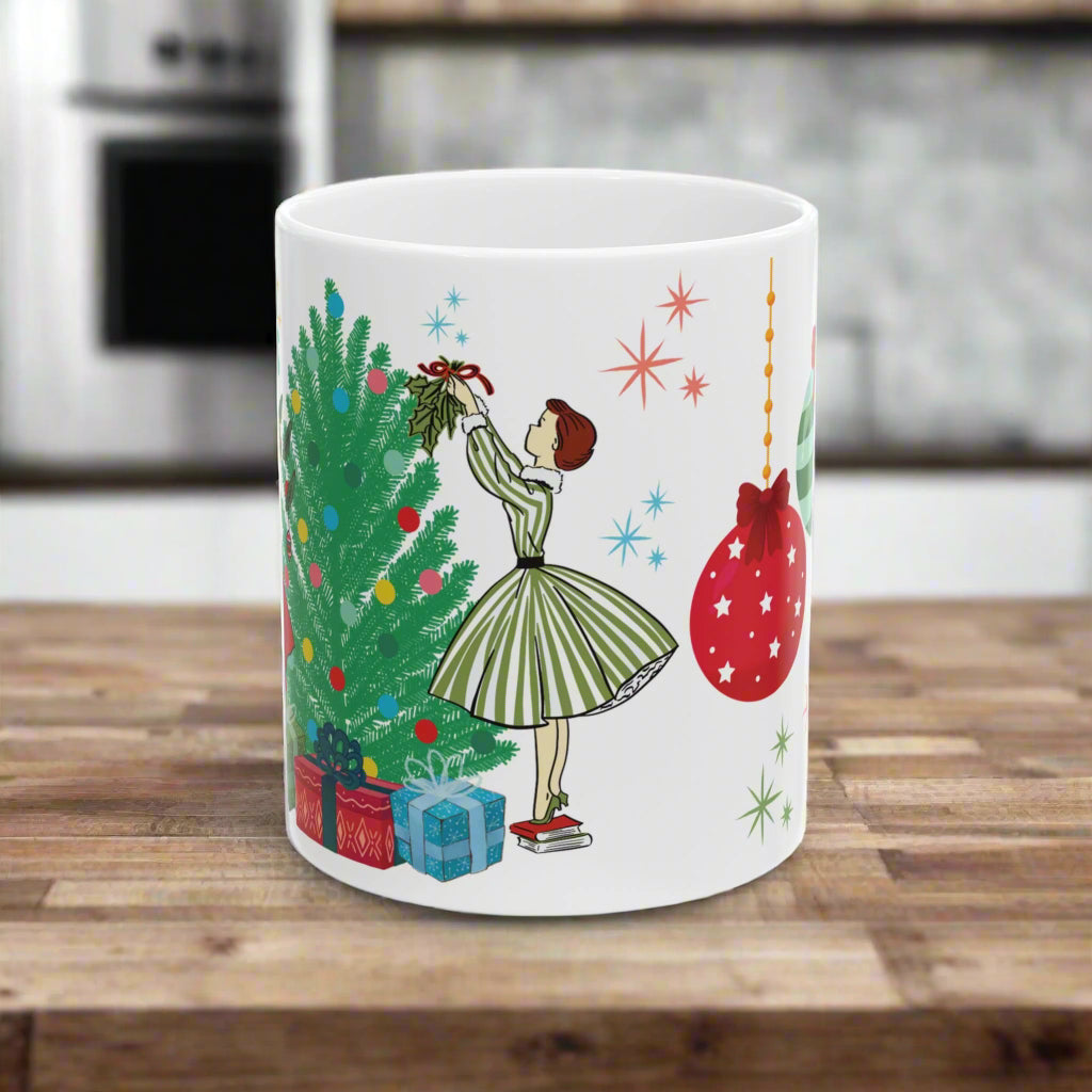 White mug with Christmas-themed design featuring a woman, tree, and ornaments on a white background