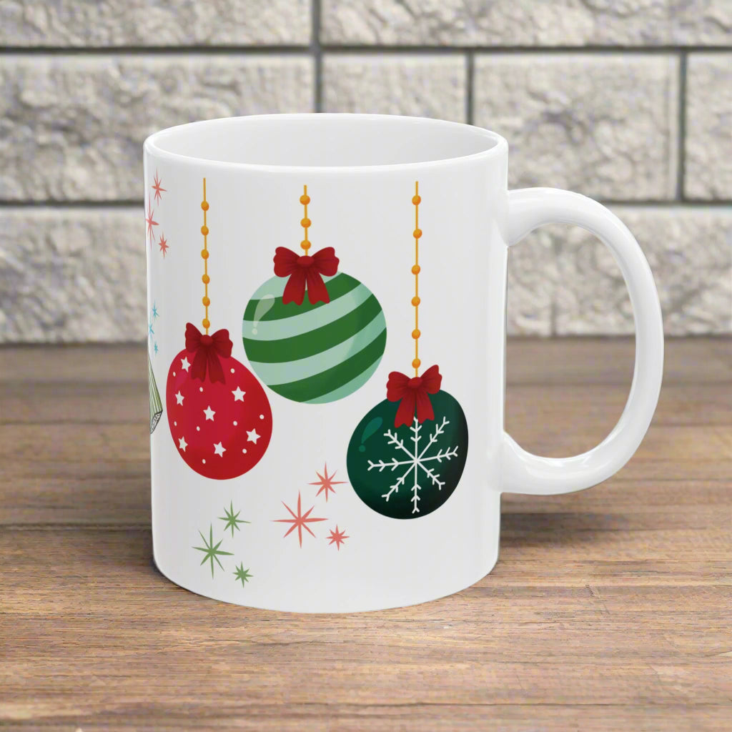 White mug with Christmas-themed decorations on a white background
