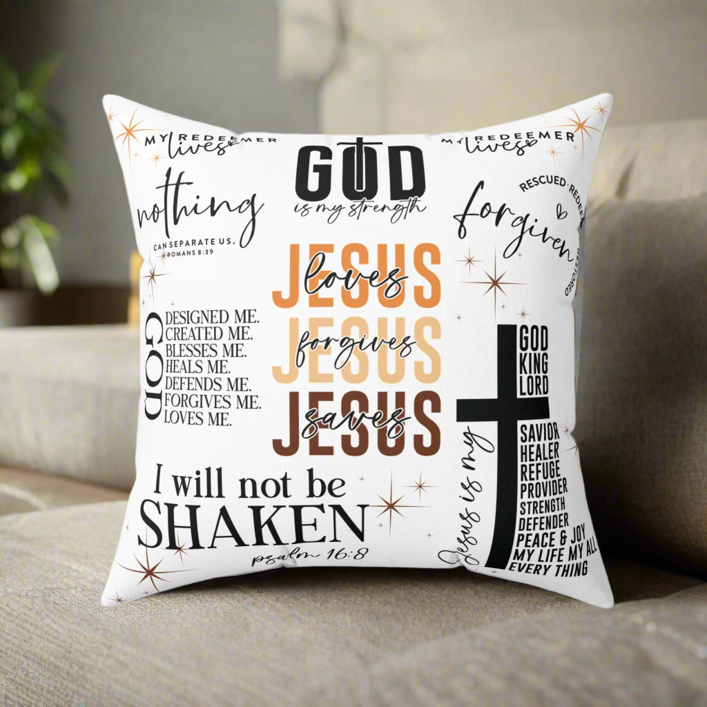 Decorative pillow with religious text and cross design on a white background