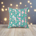 Decorative pillow with a festive pattern on a teal background