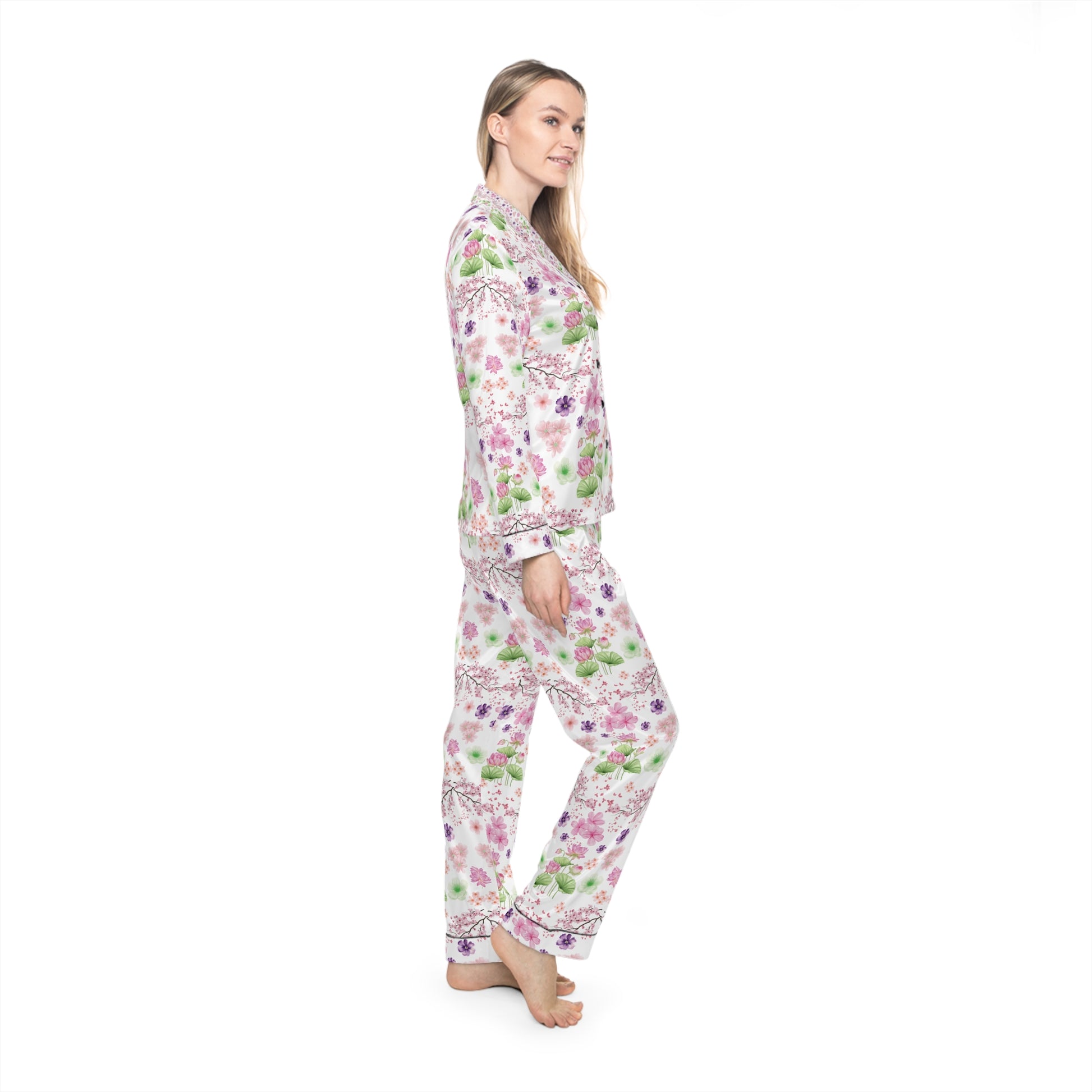 Woman wearing a floral pajama set on a white background