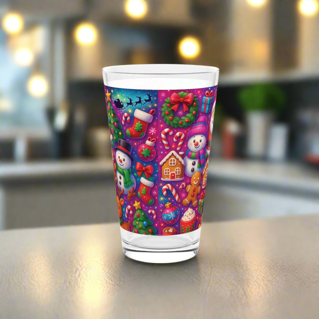 Colorful Christmas-themed glass with various festive elements on a white background