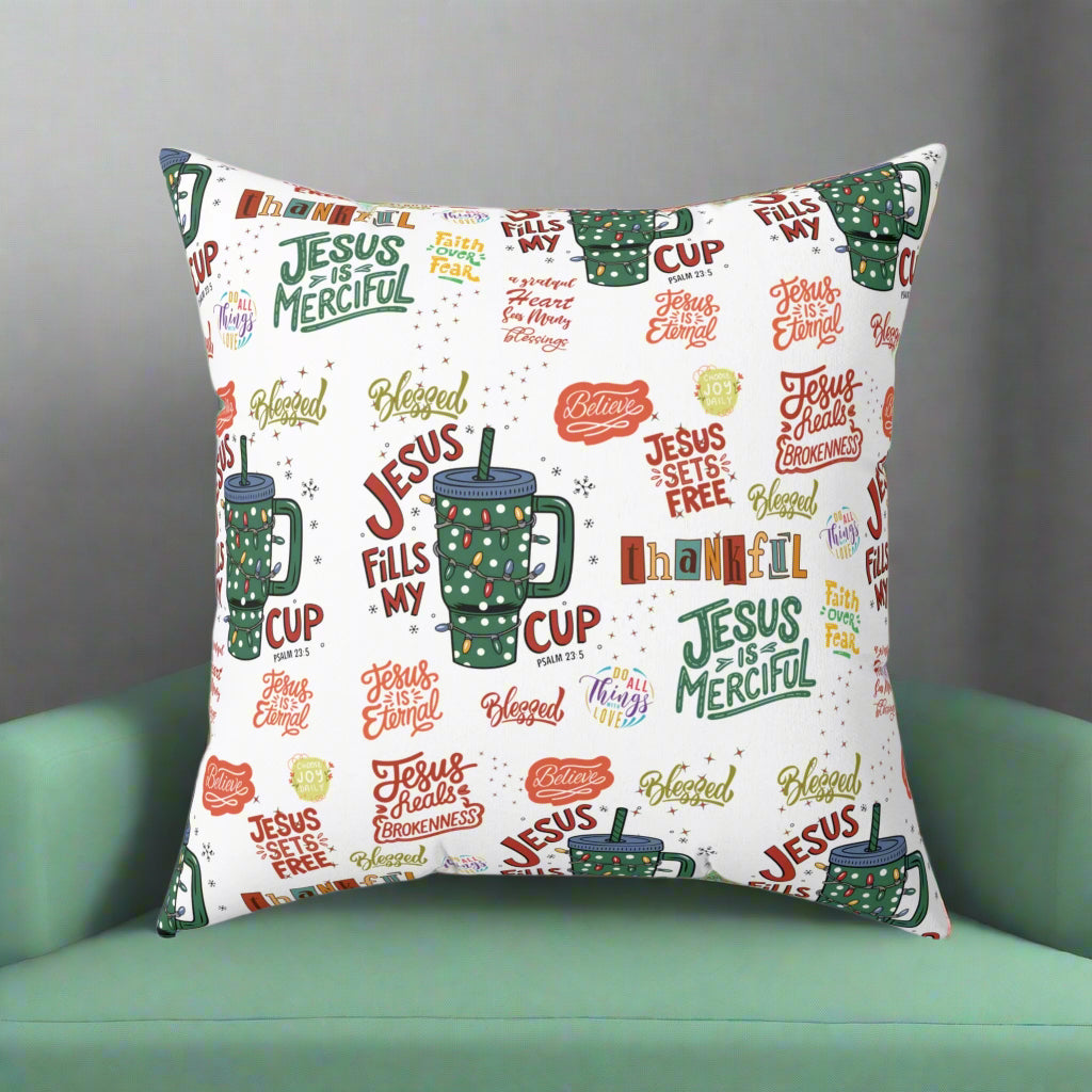 Decorative pillow with religious text and designs on a white background