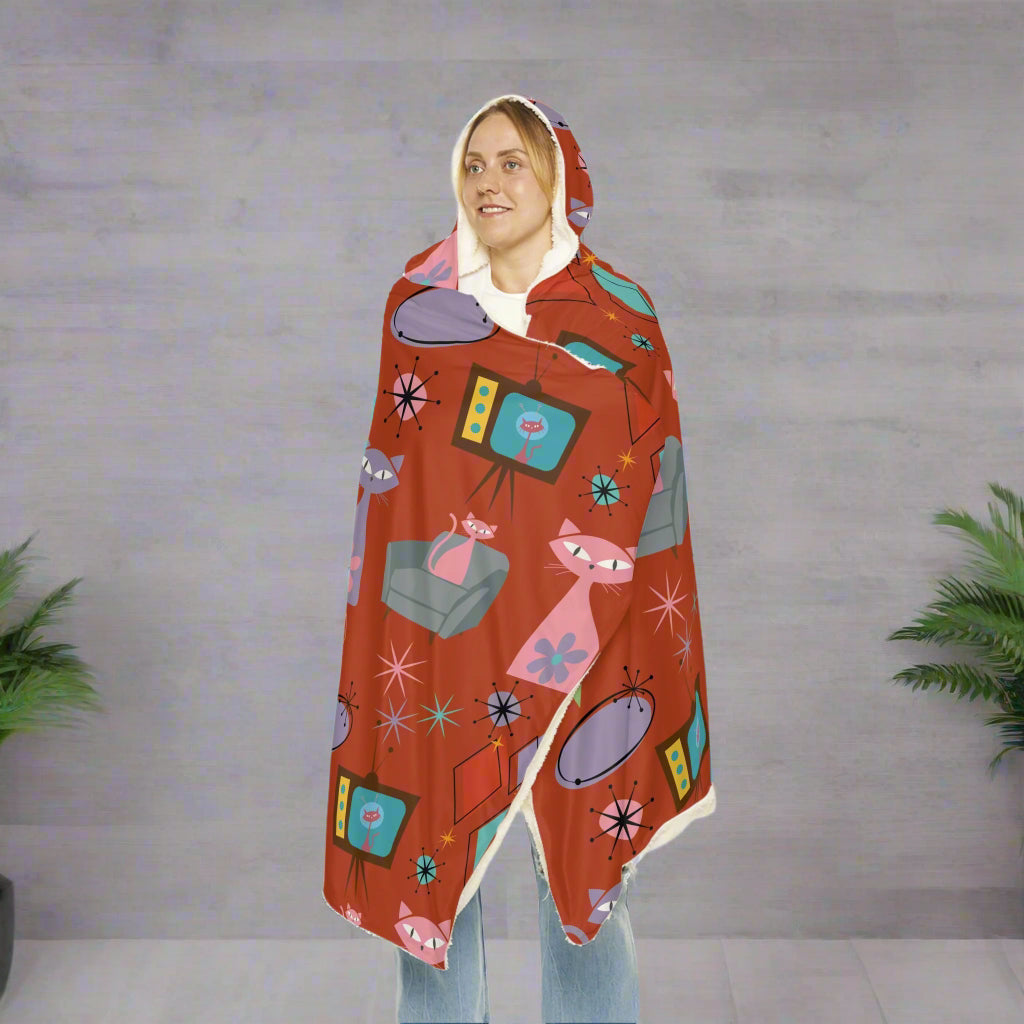 Person wrapped in a colorful patterned blanket on a white background